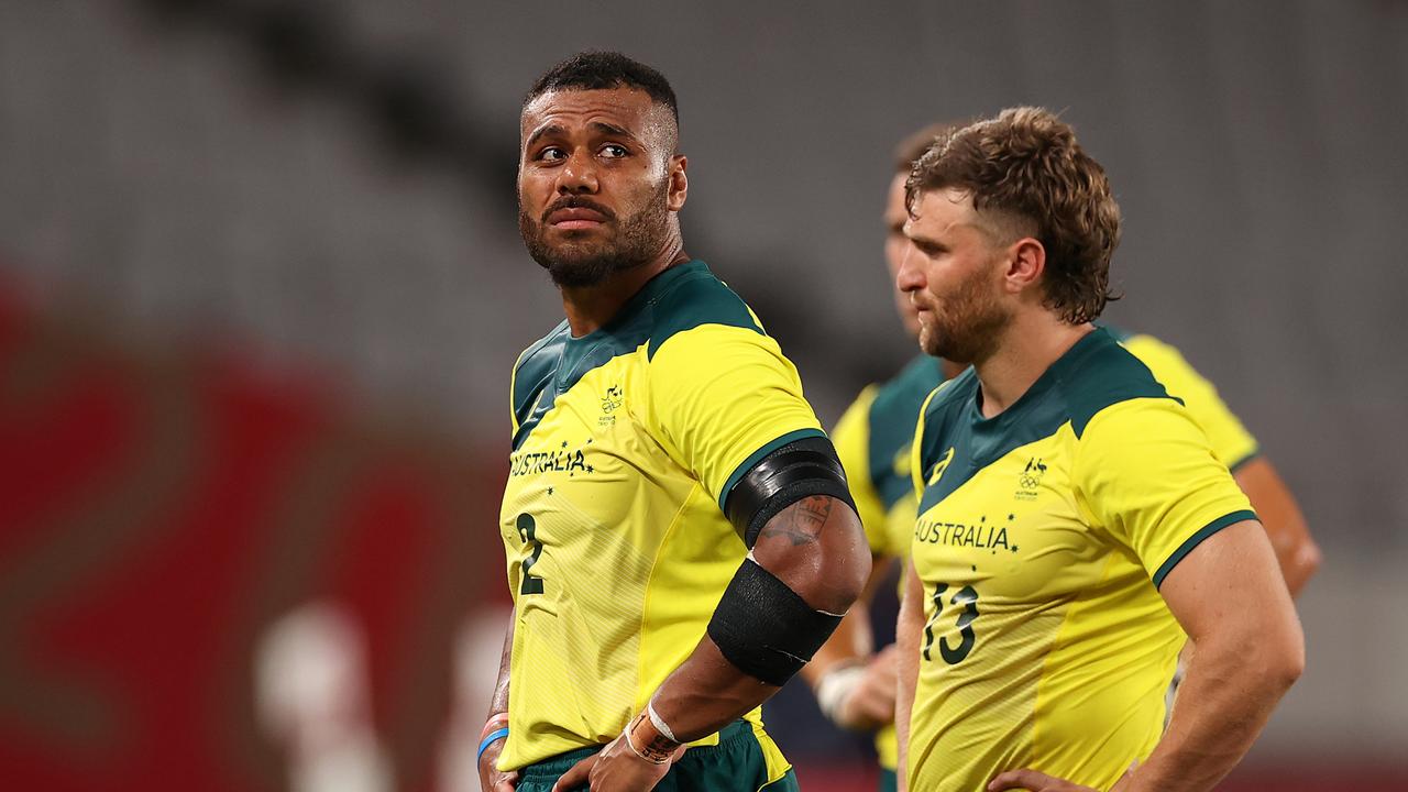 Samu Kerevi (left) and Lewis Holland are dejected following Australia’s rugby sevens loss to Fiji at the Tokyo Olympics. Picture: Dan Mullan/Getty Images