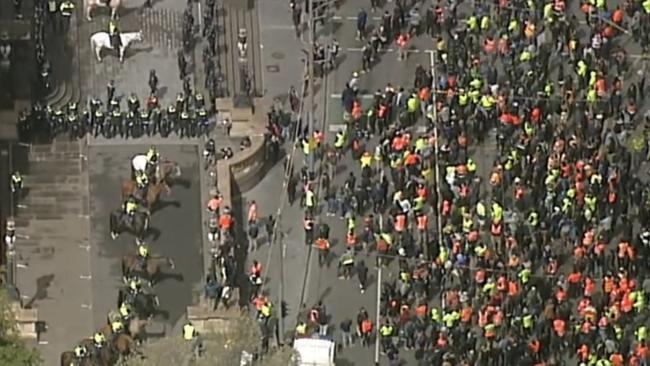 Construction workers are met by riot police on the steps of parliament: Picture: Sky News