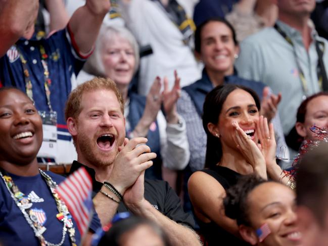 Prince Harry and Meghan Markle cheer during the wheelchair basketball match between USA and France. Picture: Getty Images