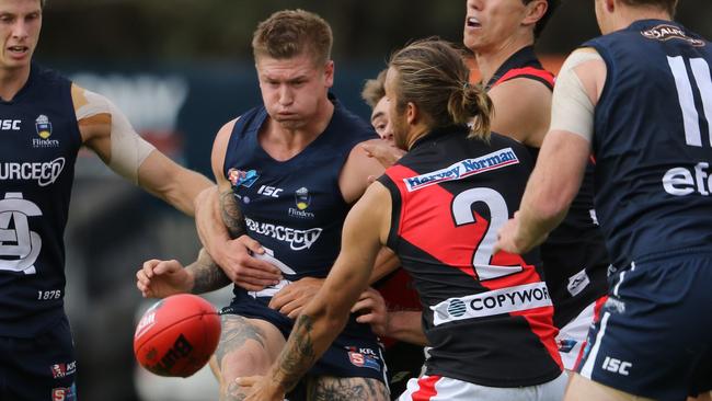 Lee Hoey (during his days for SANFL club South Adelaide) takes on a West Adelaide tackler. Picture: Nick Hook Photography