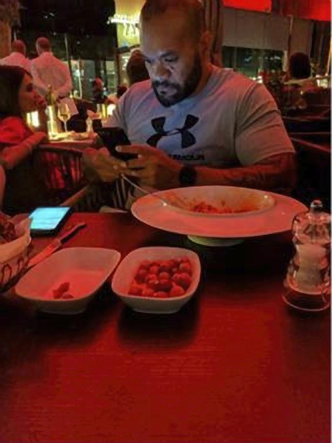 A picture taken by Hakan Ayik of Duax Ngakuru engrossed on his phone