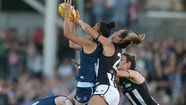 Darcy Vescio takes a strong mark in front of Sophie Casey. Picture: Wayne Ludbey