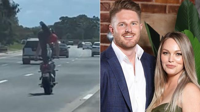 A motorbike rider pictured performing death-defying stunts while riding on the M1 in the northern Gold Coast. Picture: Melissa Rawson / Instagram.