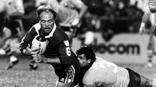 Wally Lewis is brought down by Mark McGaw.