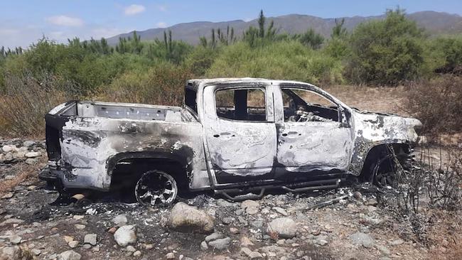 A burnt out car at a ranch several kilometres from the search site. it is believed to have belonged to the missing surfers Jake and Callum Robinson (Supplied)