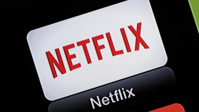 FILE - This June 24, 2015, file photo, shows the Netflix Apple TV app icon, in South Orange, N.J. Netflix reports financial results on Monday, April 18, 2016. Sports are on hold, movie theaters are closed and so are amusement parks. But Americans held captive at home by the coronavirus can turn to Netflix, Amazon, Hulu and other streaming services, outliers in an entertainment industry otherwise brought to an unprecedented standstill. (AP Photo/Dan Goodman, File)