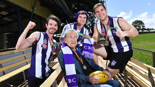 Luke Johansen with grandfather Raymond Semmler together with Luke’s two brothers Jake Johansen and Brad Johansen. The Johansen brothers featured with CBC Old Collegians and helped the Dolphins win the grand final. Jake quit SANFL club Woodville-West Torrens mid-season to line-up with CBC after he promised Semmler he would play footy with his brothers. Picture: AAP/Keryn Stevens)