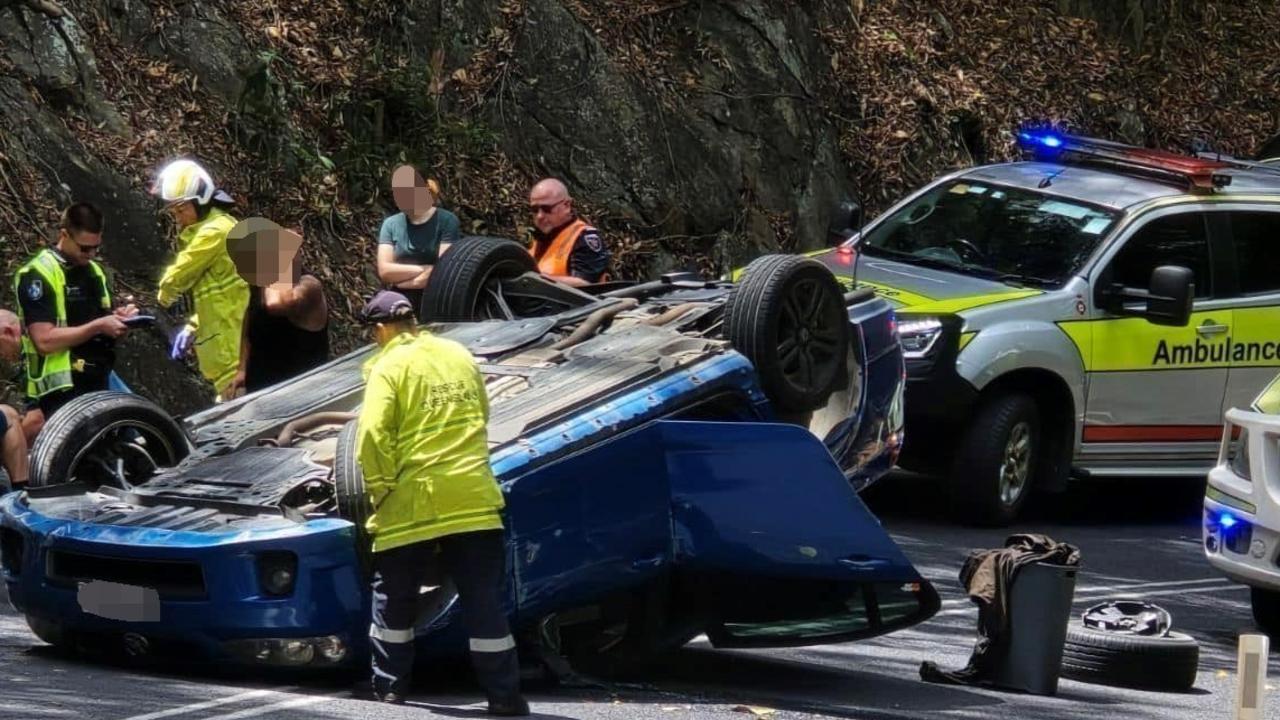 The Kuranda Range Rd was closed in both directions after a blue sedan has flipped onto its roof. Picture: Andrew Moss / Facebook