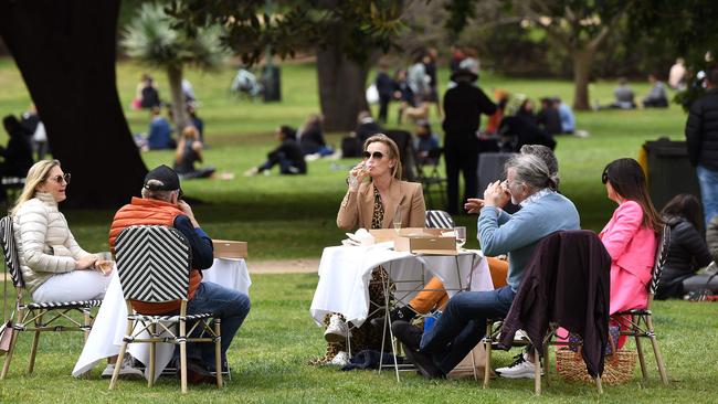 We will have to wait another seven weeks for the pleasure of sinking a beer at a sunny picnic with our fully vaccinated friends. Picture: AFP