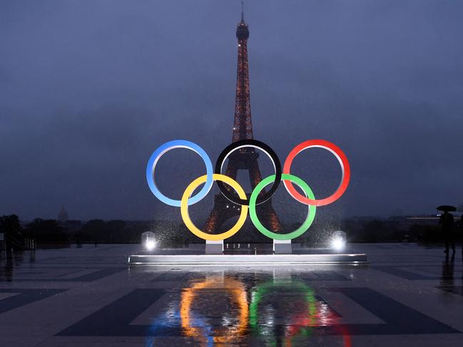 (FILES) A picture shows the Olympics Rings on the Trocadero  Esplanade near the Eiffel Tower in Paris, on September 13, 2017, after the  International Olympic Committee named Paris host city of the 2024 Summer Olympic Games. The Olympic rings will be installed on the Eiffel Tower for the Paris 2024 Olympic Games, it was learned from the site's operator said on April 8, 2024. (Photo by CHRISTOPHE SIMON / AFP)