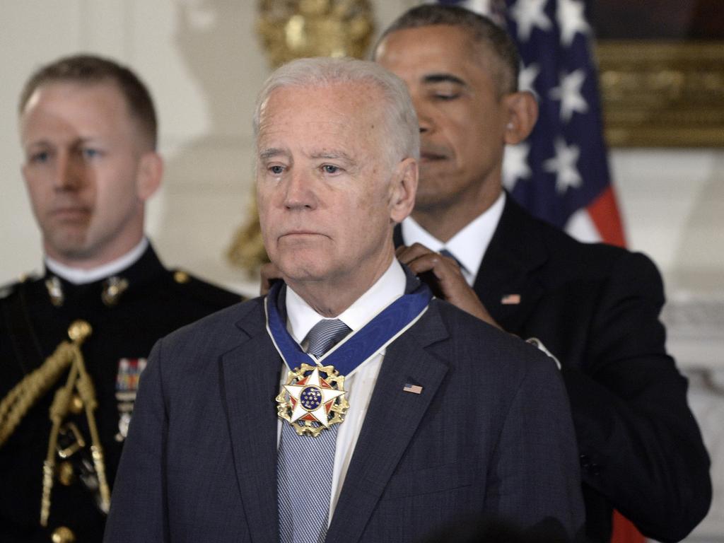 US President Barack Obama (R) presenting the Medal of Freedom to Vice-President Joe Biden in 2017. Picture: Olivier Douliery-Pool/Getty Images