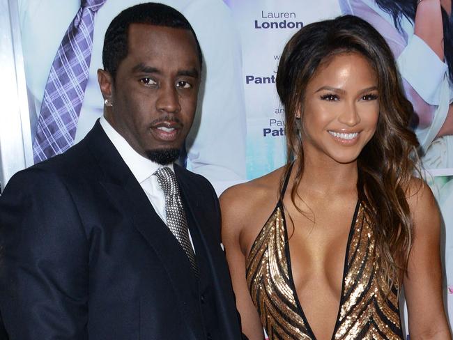 (FILES) Sean P. Diddy Combs with Cassie Ventura attend the premiere of 'The Perfect Match' at the Arclight Theatre in Los Angeles on March 7, 2016. Superstar rapper and music industry mogul Sean Combs was sued November 16 by the singer Cassie, who accused him of rape and physical abuse.  The hip-hop artist, known as both Puff Daddy or Diddy, subjected the R&B singer, whose real name is Casandra Ventura, to more than a decade of coercion by physical force and drugs as well as a 2018 rape, she said in her suit, filed in federal court in Manhattan. (Photo by Chris Delmas / AFP)