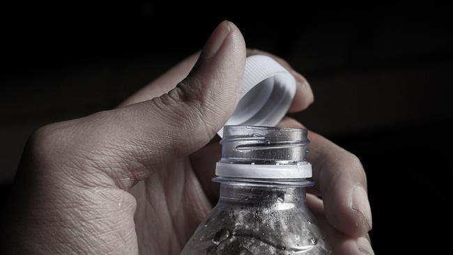 Person opens the lid of a plastic drinking bottle. Picture: iStock