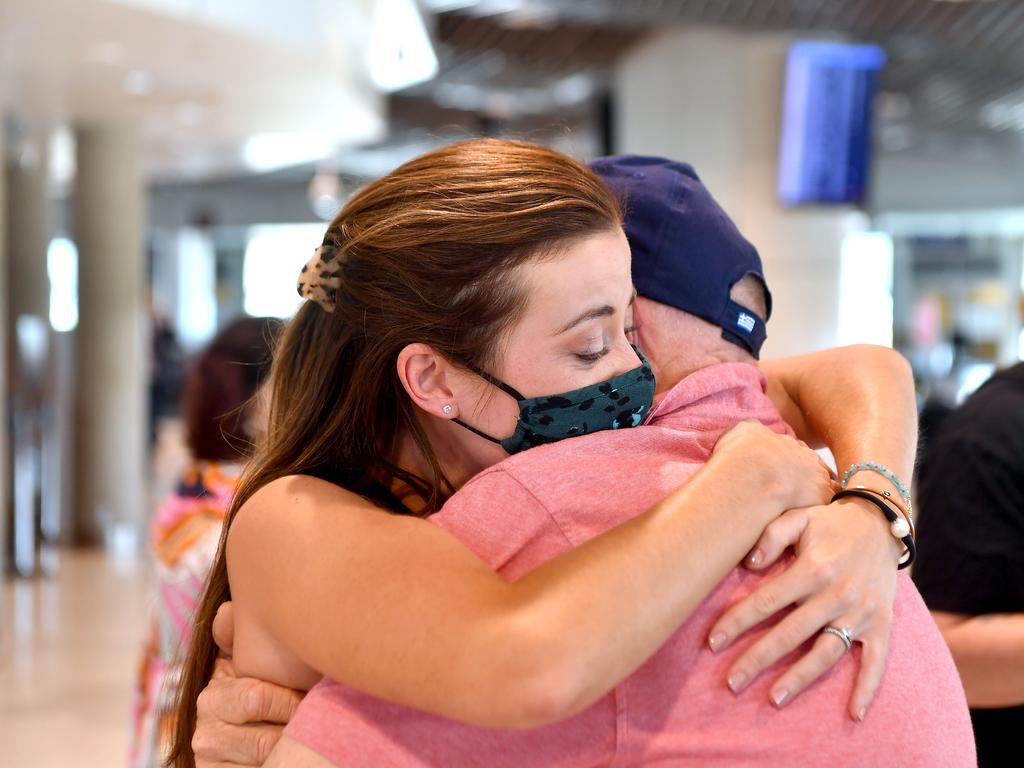 Rebecca Underhill hugs her dad Paul Gimpel after arriving in Brisbane. Picture: NCA NewsWire / John Gass
