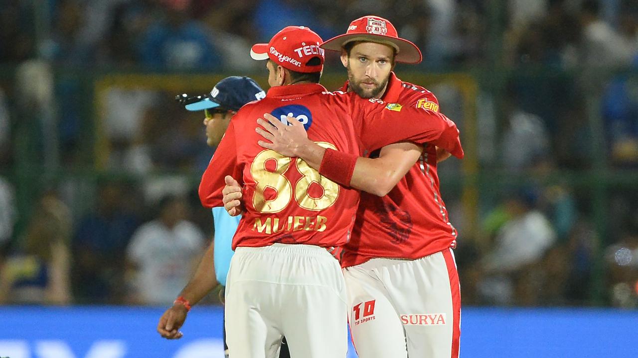 Kings XI Punjab bowler Andrew Tye (R) celebrates with a teammate after he dismissed Rajasthan Royals batsman Jofra Archer.