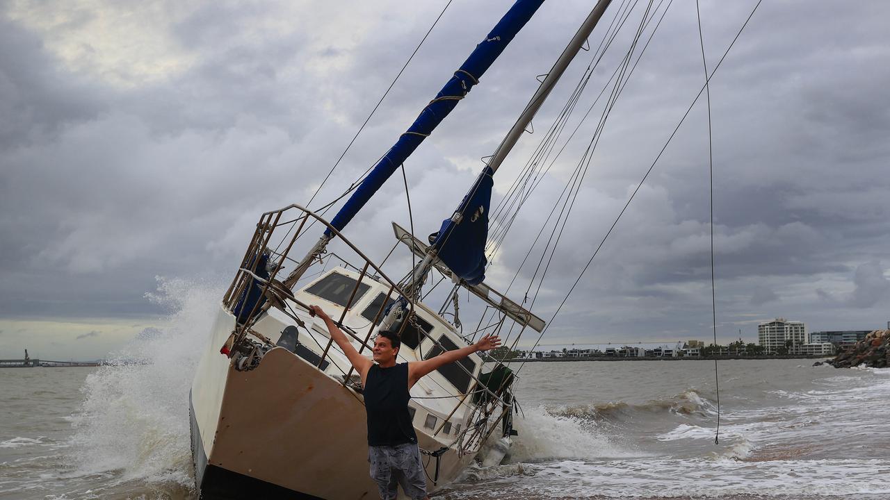 Townsville locals including Dr Deepak Doshi woke early to inspect the damage along The Strand left from TC Kirrily that hit overnight. Picture: Adam Head