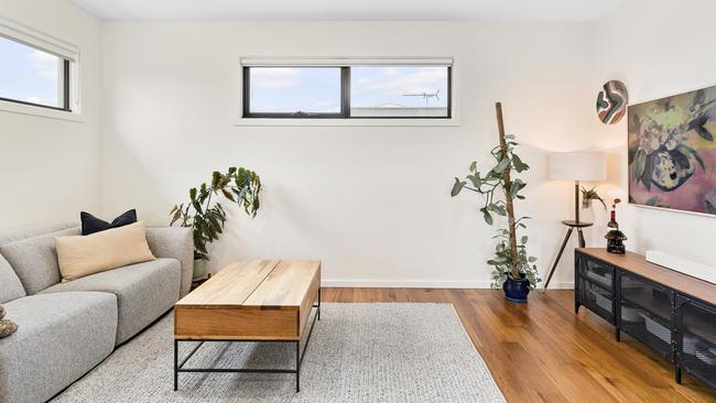 The first floor living space adjacent to the open-plan kitchen.