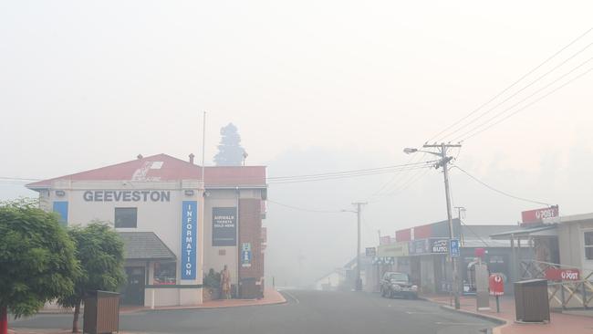The main street of Geeveston under heavy smoke early on Sunday morning. Picture: NIKKI DAVIS-JONES