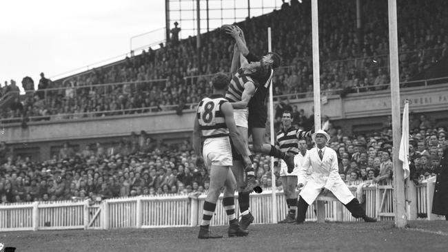 Coleman battles with the Geelong defenders at Windy Hill.