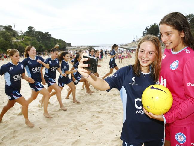 L to R: Dunbar Rover FC Girls U17 team members Elisha McMorrow -16 and Emmanuelle Tobiano -15 stop for a selfie  during their  beach training session. Dunbar Rovers FC  is making it free for girls to play rep football in a bid to encourage more youngsters to stay in the sport.Picture: John Appleyard