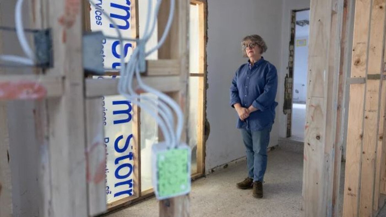 Chair of the Maribyrnong Community Recovery Committee and local resident Madeleine Serle in her damaged home.