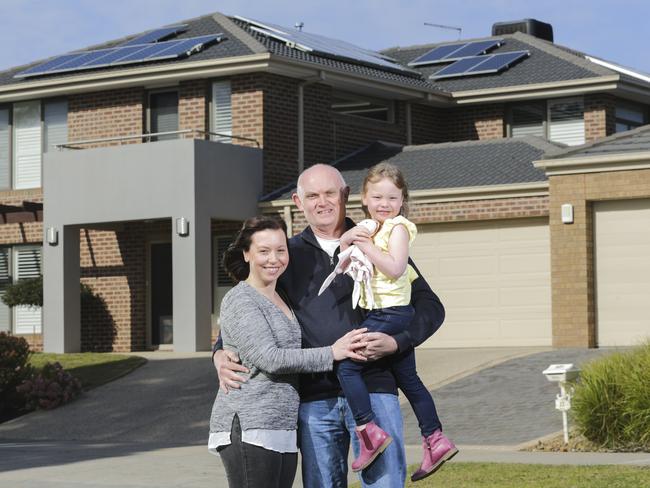 Tracey and Clive Mottershead with their daughter Olive age 5 looking happy about having solar panels. Picture by Wayne Taylor 18th August 2018.