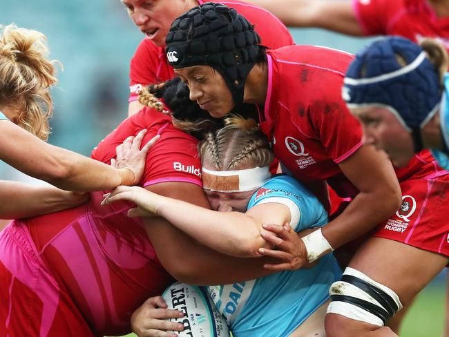 SYDNEY, AUSTRALIA - APRIL 20:  Emily Robinson of New South Wales is tackled during the Super W Grand Final match between the the New South Wales Women and the Queensland Women at Allianz Stadium on April 20, 2018 in Sydney, Australia.  (Photo by Matt King/Getty Images)