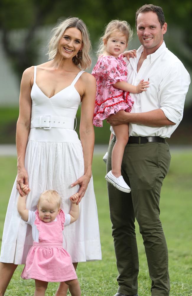 Kimberley Busteed with children Evelyn (2) and Victoria (10 months) and husband Chris Simpson. Portrait: Peter Wallis