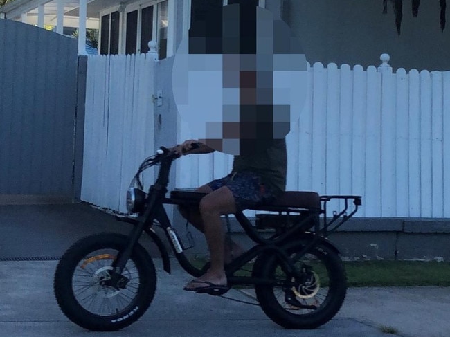 A man, wearing thongs and no helmet, on an e-bike on the shared path along Pittwater Rd, Manly. Picture: Jim O'Rourke