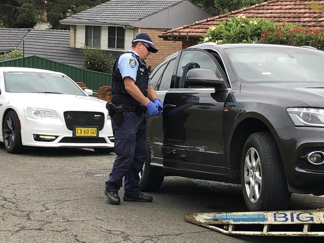 Police tow the allegedly stole Audi on Thursday morning. Picture: Madeline Crittenden