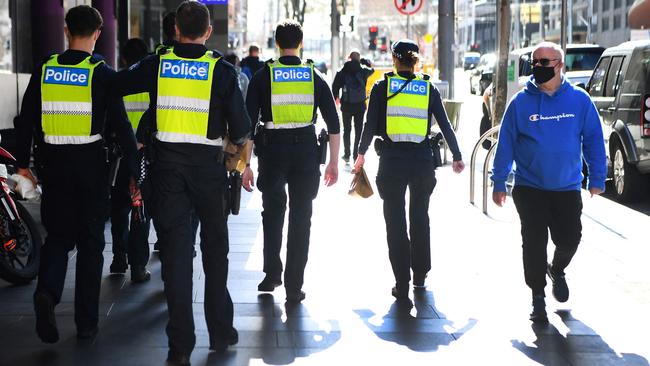 Police patrolling a Melbourne street during the city’s sixth lockdown. Picture: William West