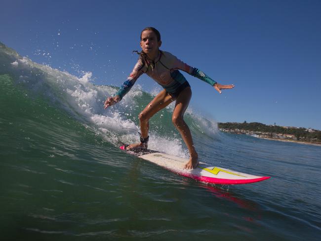 Mia Baker at her local beach.   Don't take this away from us. Be smart with social distancing in the surf.