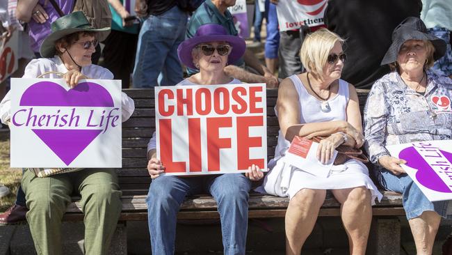 Protesters hold placards during a pro-life rally in Brisbane, Saturday, September 1, 2018. Thousands of people rallied through Brisbane's CBD to protest the Queensland government's proposed move to decriminalise abortion. (AAP Image/Glenn Hunt) NO ARCHIVING