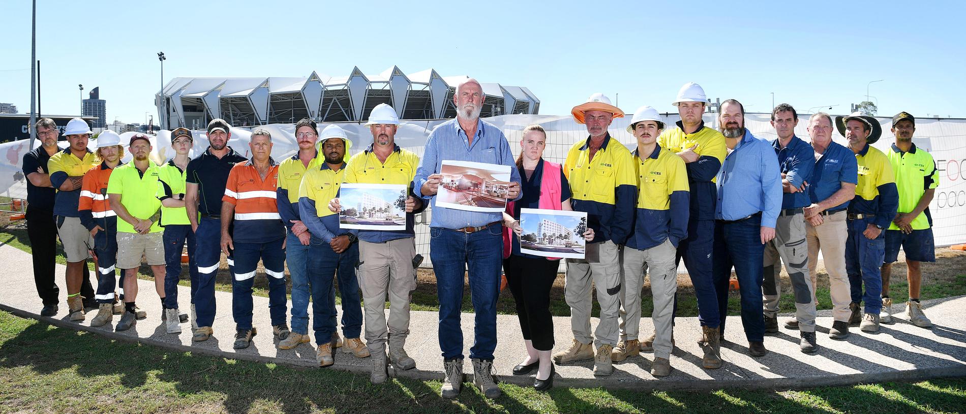 CES Group Construction manager Pat Donla (middle) with disappointed representatives from Boral, CES Civil, METALRIG, CES Construction, Glen Carroll Painting and MILLAIR Climate Control, pictured in front of the Hilton Garden Inn's proposed construction site. Picture: Shae Beplate.