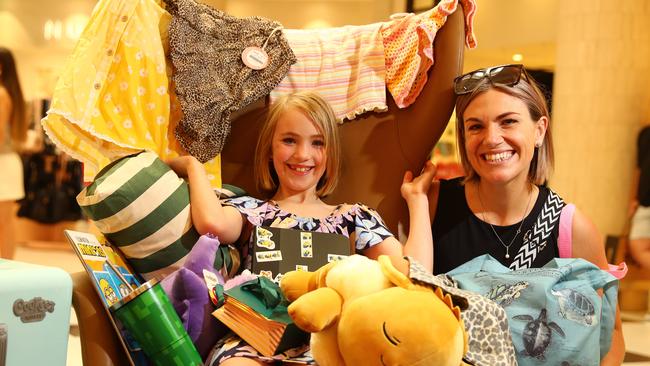 Eight year old Remy on a shopping  spree at the Boxing Day sales in Westfield with her mum Tani Jacobi. Picture: Alison Wynd