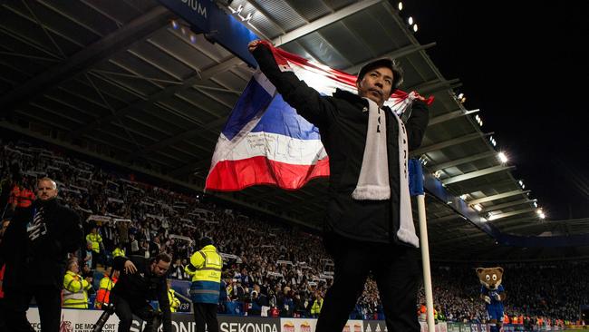 Apichet Srivaddhanaprabha (C) the son of Leicester City's late Thai chairman Vichai Srivaddhanaprabha applauds the fans following the English Premier League football match between Leicester City and Burnley at King Power Stadium in Leicester, central England on November 10, 2018. (Photo by OLI SCARFF / AFP) / RESTRICTED TO EDITORIAL USE. No use with unauthorized audio, video, data, fixture lists, club/league logos or 'live' services. Online in-match use limited to 120 images. An additional 40 images may be used in extra time. No video emulation. Social media in-match use limited to 120 images. An additional 40 images may be used in extra time. No use in betting publications, games or single club/league/player publications. /