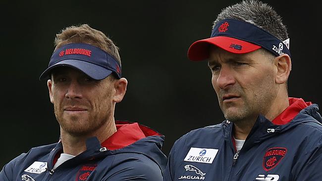 MELBOURNE, AUSTRALIA - DECEMBER 09: Demons assistant coach Adem Yze (R) speaks with Demons head coach Simon Goodwin during a Melbourne Demons AFL training session at Casey Fields on December 09, 2020 in Melbourne, Australia. (Photo by Daniel Pockett/Getty Images)