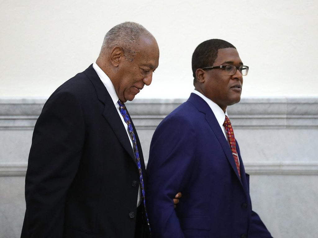 Actor and comedian Bill Cosby is led from the courtroom during a break by his spokesman Andrew Wyattat the Montgomery County Courthouse in 2018.