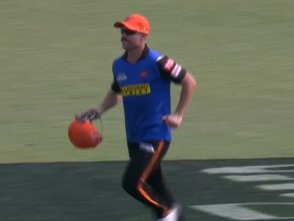 David Warner running the drinks.