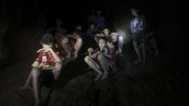 The boys and their soccer coach as they were found in a partially flooded cave in Mae Sai, Chiang Rai province, northern Thailand, on July 2, 2018. Picture: Tham Luang Rescue Operation Center via AP.