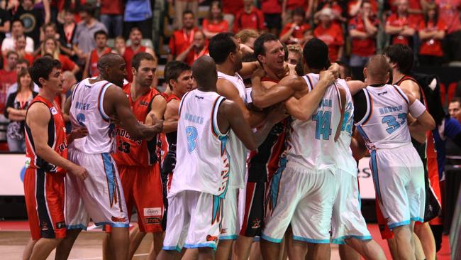 A brawl erupts between Perth Wildcats and Gold Coast Blaze players.