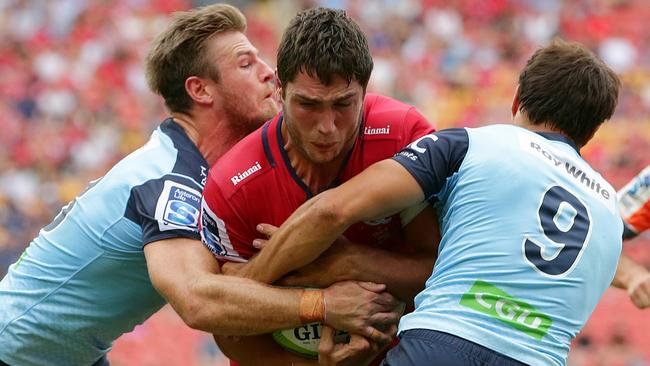 Rob Simmons charging onto NSW defenders. Picture: Peter Wallis