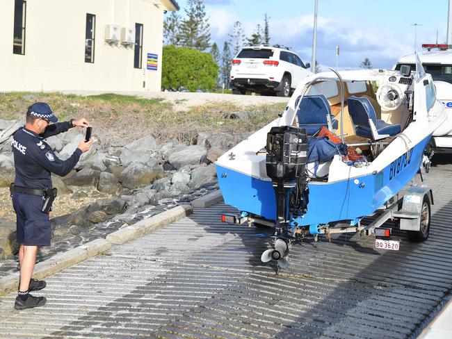 The capsized boat is returned to shore. Picture: Patrick Woods