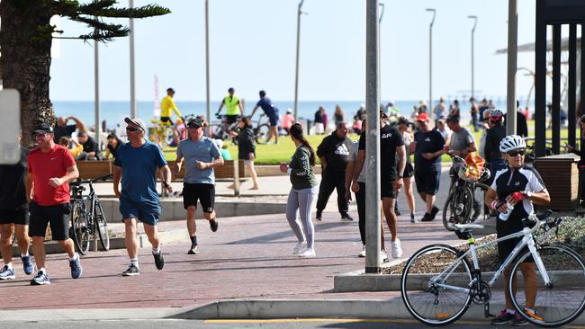 Crowds of people at Henley Beach on Good Friday morning. Picture: AAP/Mark Brake