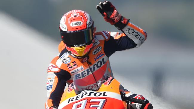 Repsol Honda Team's Spanish rider Marc Marquez waves as he clocked the best time of the warm-up ahead of the French motorcycling Grand Prix on May 20, 2018 in Le Mans, northwestern France.  / AFP PHOTO / JEAN-FRANCOIS MONIER