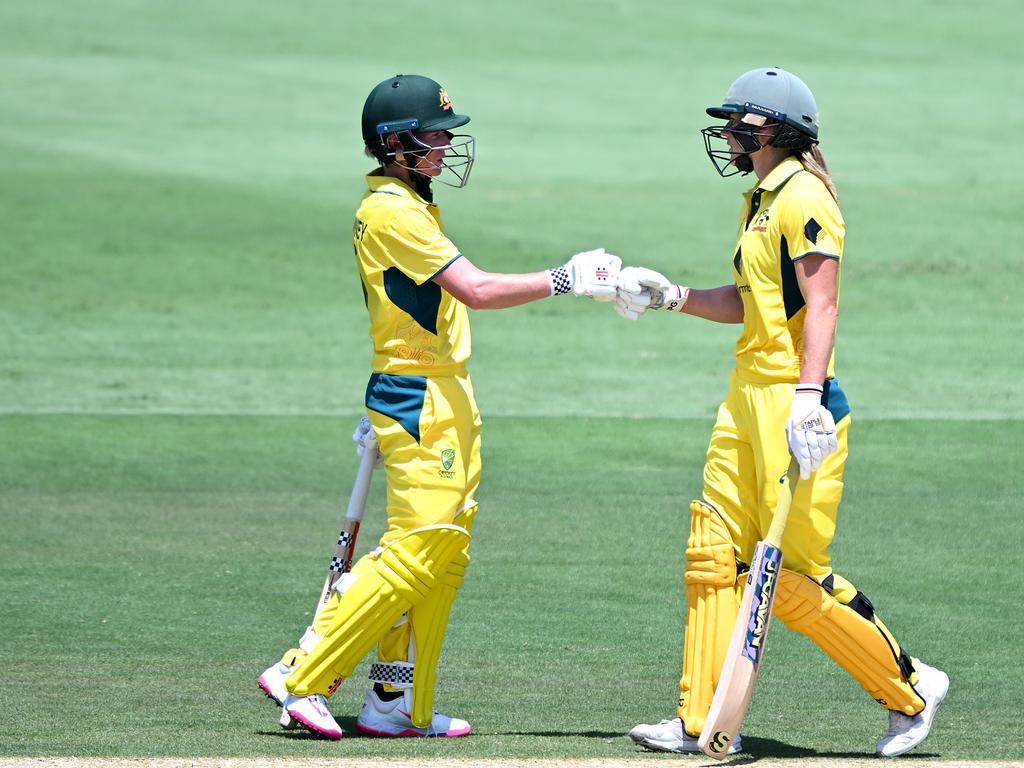 Beth Mooney (left) and Ellyse Perry congratulate each other during Australia’s weekend win over India. Picture: Bradley Kanaris/Getty Images