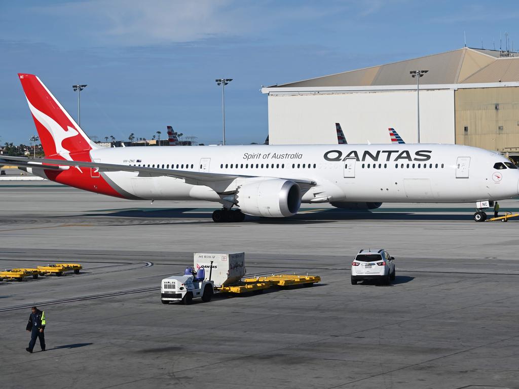 Qantas international planes are going to stay grounded for a while longer. Picture: Daniel SLIM / AFP