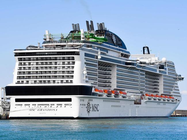 The MSC Grandiosa at the port of Civitavecchia, 70km northwest of Rome, in March. Picture: AFP