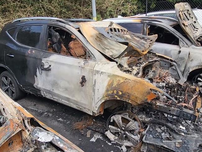 The damaged cars in a Sydney Airport carpark. Picture: Fire and Rescue NSW