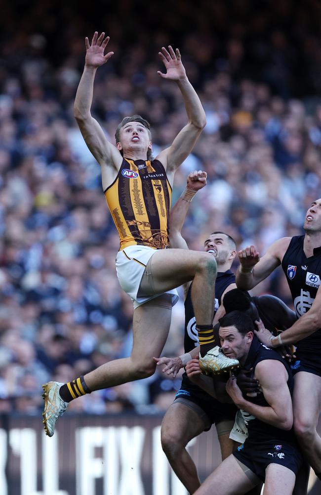 Calsher Dear of the Hawks flies for a screamer in the third quarter against Carlton. Picture: Mark Stewart